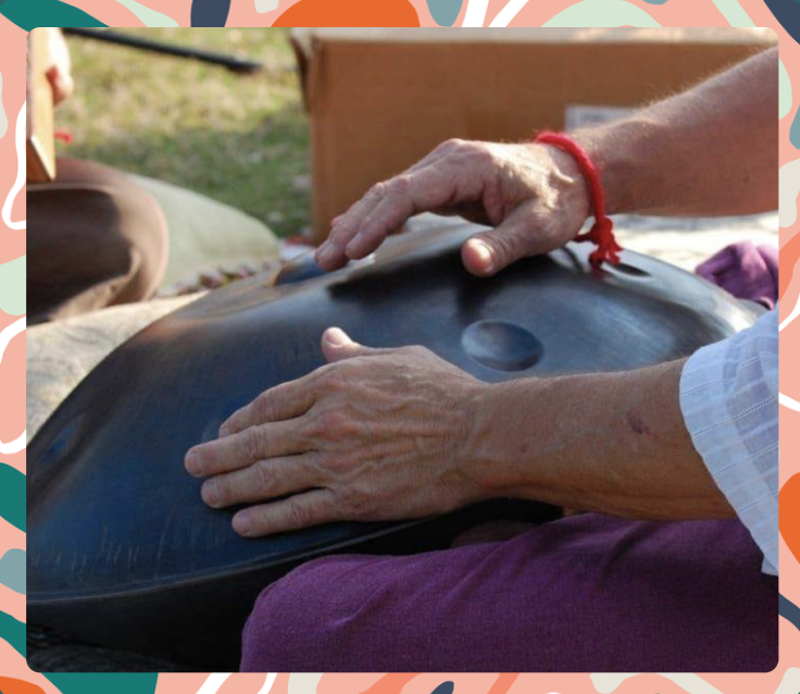 Image of an artist with his handpan drum